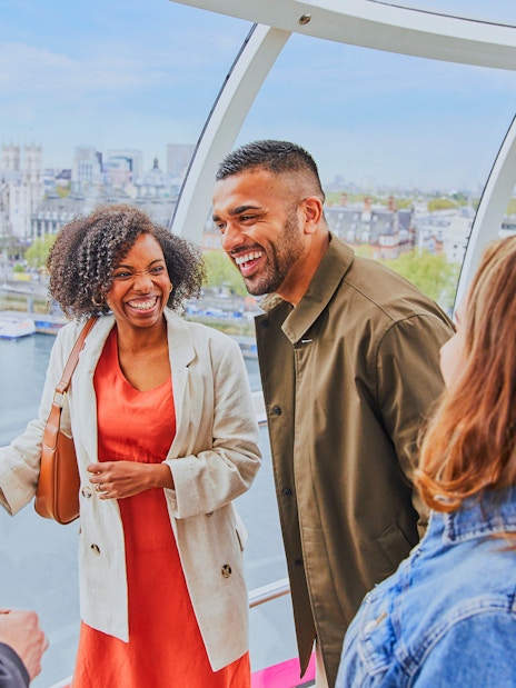 Group enjoying a ride on the London Eye with Big Ben in the background.