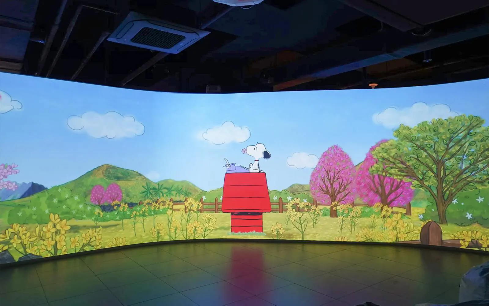 Snoopy on red doghouse in colorful garden at Snoopy Garden Jeju.