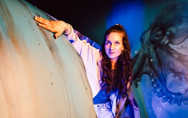Woman exploring interactive exhibit at Prison Island Brisbane.
