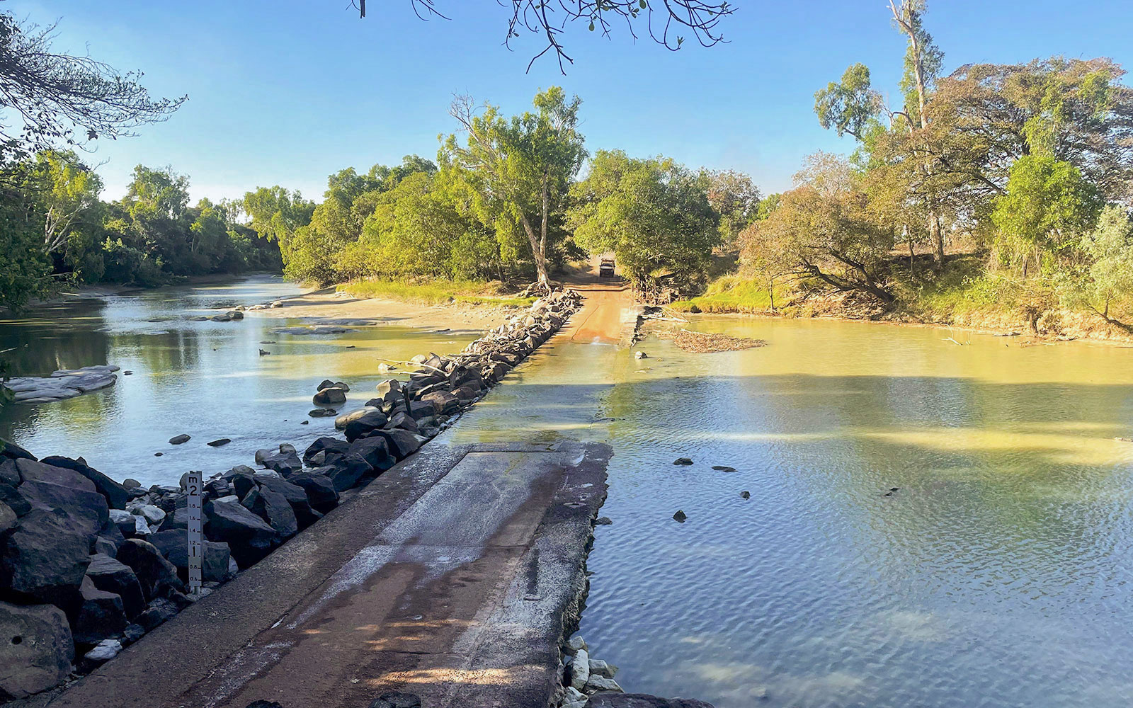 Crossing over a rocky causeway in Kakadu National Park during a 1-day guided tour from Darwin.