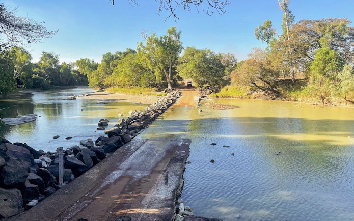 Crossing over a rocky causeway in Kakadu National Park during a 1-day guided tour from Darwin.