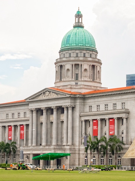 National Gallery Singapore exterior with dome and banners.