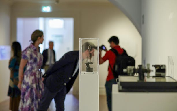 Visitors observing an exhibit at the Dynamic Eye Exhibition, Atkinson Museum Porto.