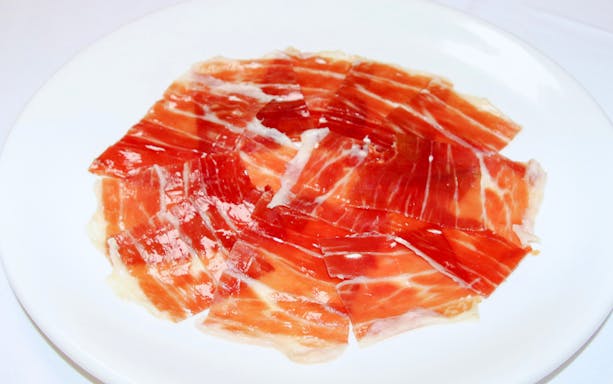 Jamón ibérico on a plate at Tablao La Cantaora, Seville.