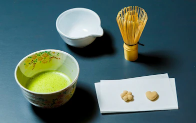 Matcha tea bowl, whisk, and sweets for tea ceremony in Kyoto Karasuma area.