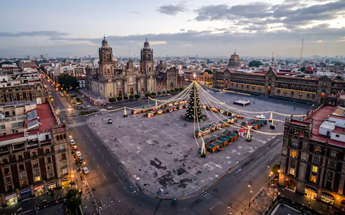 Zócalo square with festive decorations and Mexico City Metropolitan Cathedral, Mexico City.