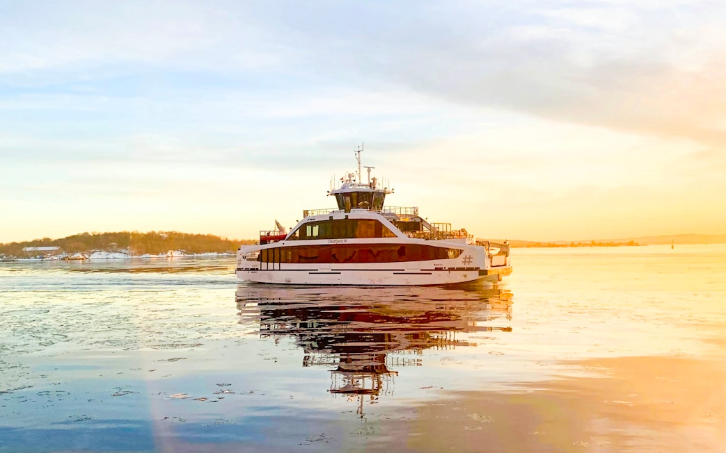 Ferry cruising during sunset on Oslo Fjord, Norway.