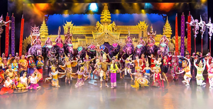Dancers performing traditional Thai dance on stage at Phuket Fantasea Theme Park, Thailand.