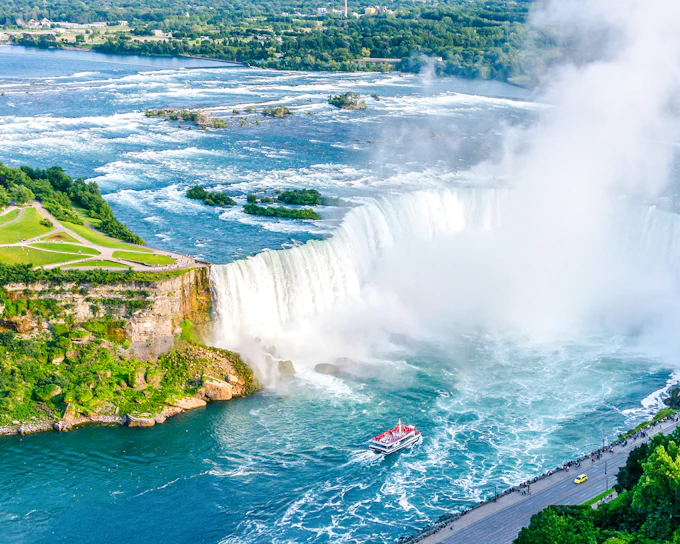 From Toronto: Niagara Falls Day Tour with Hornblower Cruise, Journey Behind the Falls & Skylon Tower