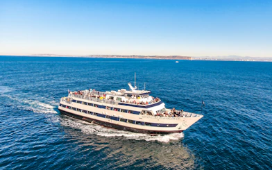 San Diego whale watching cruise ship on open ocean with passengers.