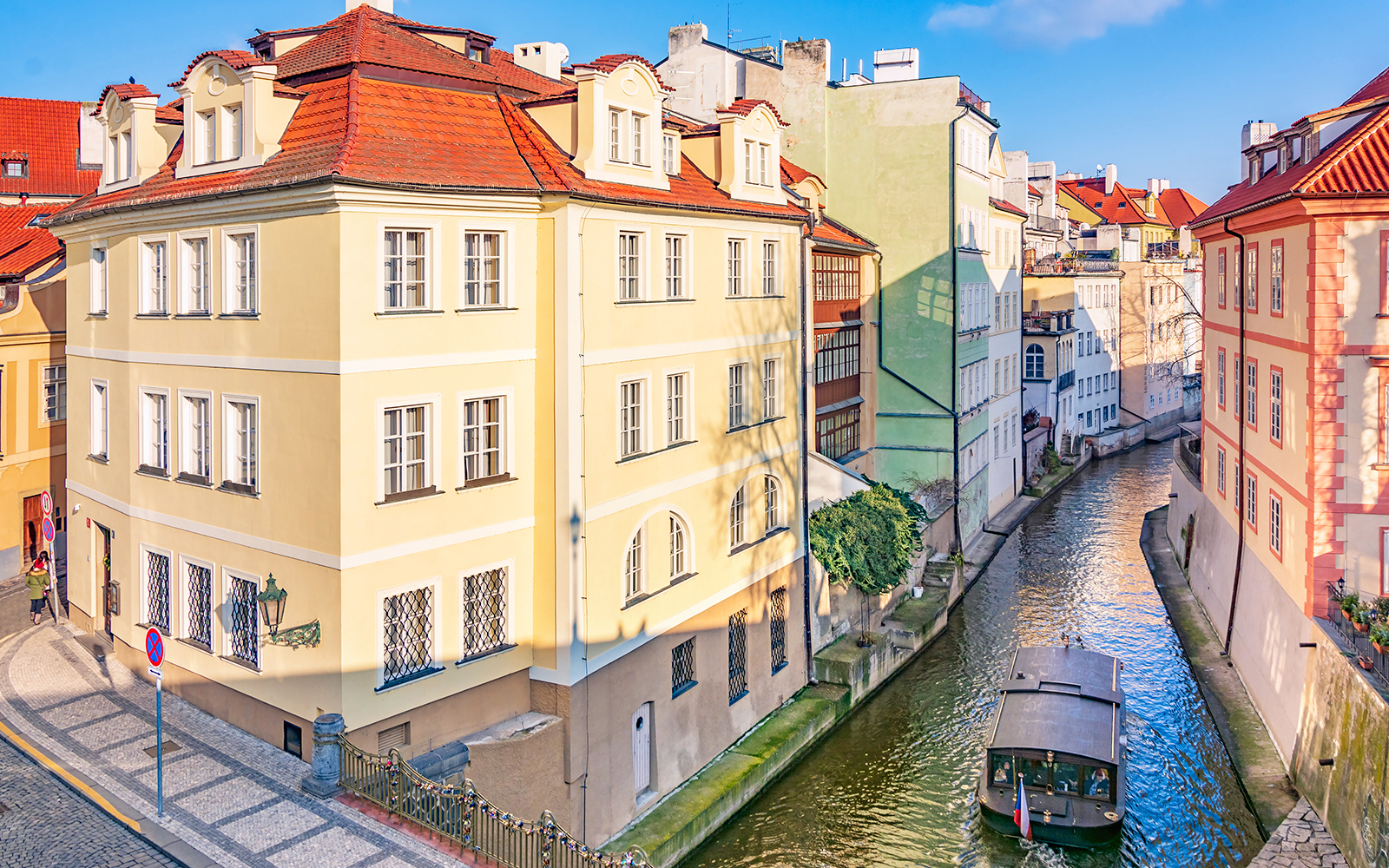 Street and water channel near the Charles Bridge in the Old Town in Prague, Czech Republic