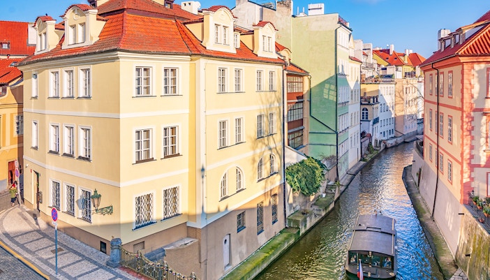 Street and water channel near the Charles Bridge in the Old Town in Prague, Czech Republic