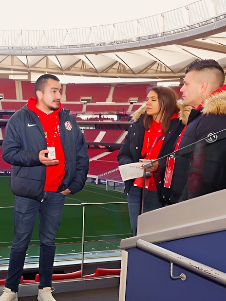 Tourists with guide at Cívitas Metropolitano stadium, Madrid, during a guided tour.