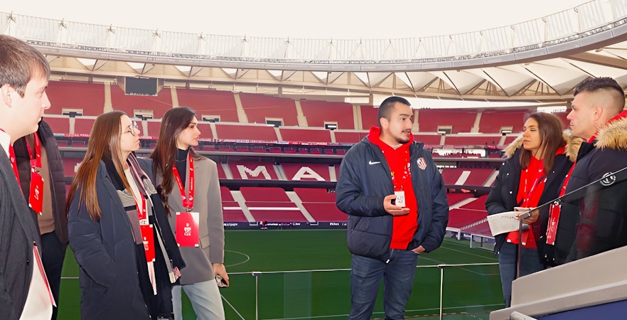 Tourists with guide at Cívitas Metropolitano stadium, Madrid, during a guided tour.