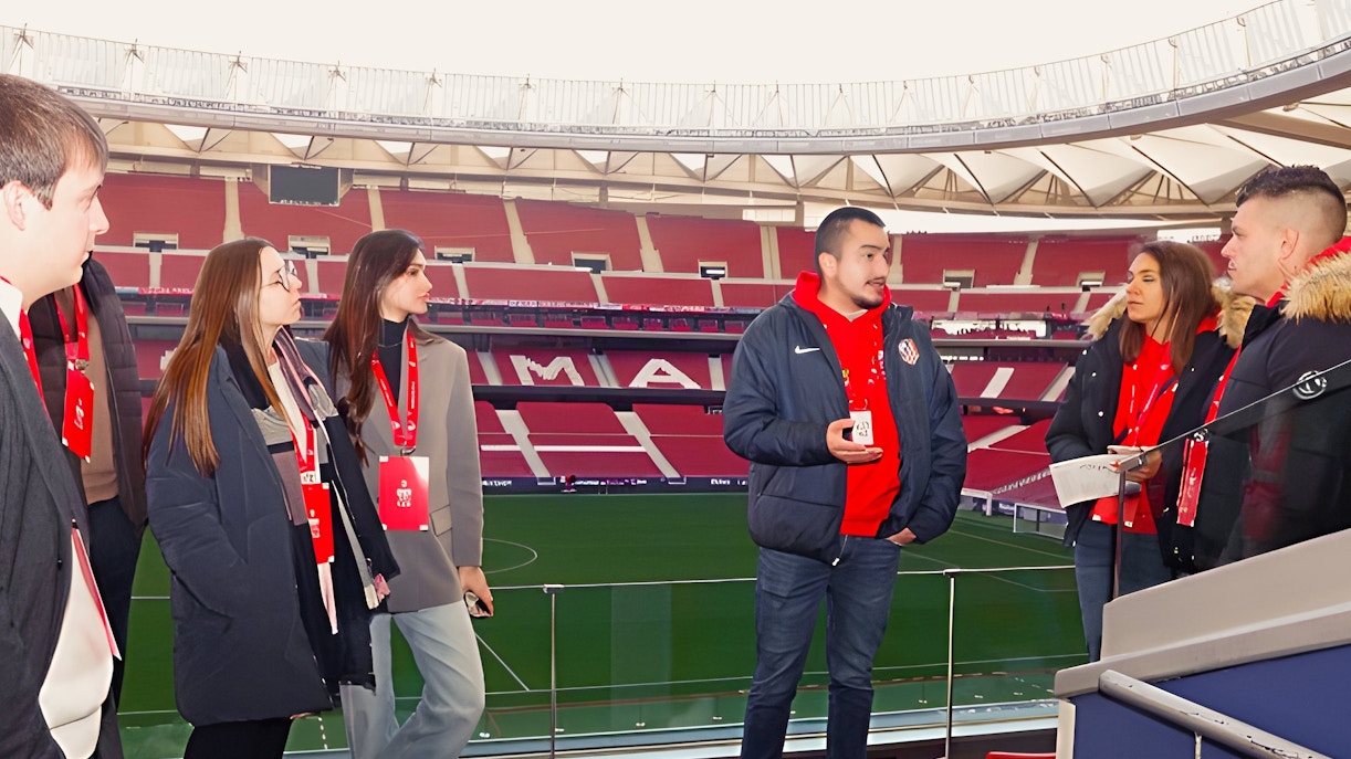 Tourists with guide at Cívitas Metropolitano stadium, Madrid, during a guided tour.