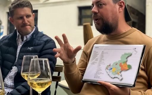 Local guide explaining wine regions during a food tour in Venice.
