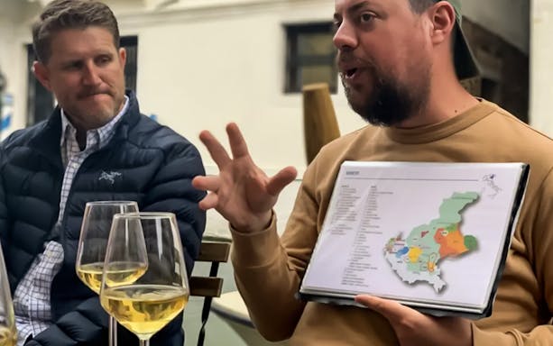Local guide explaining wine regions during a food tour in Venice.