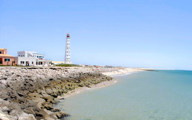 Farol Island lighthouse and beach in Ria Formosa, Portugal.