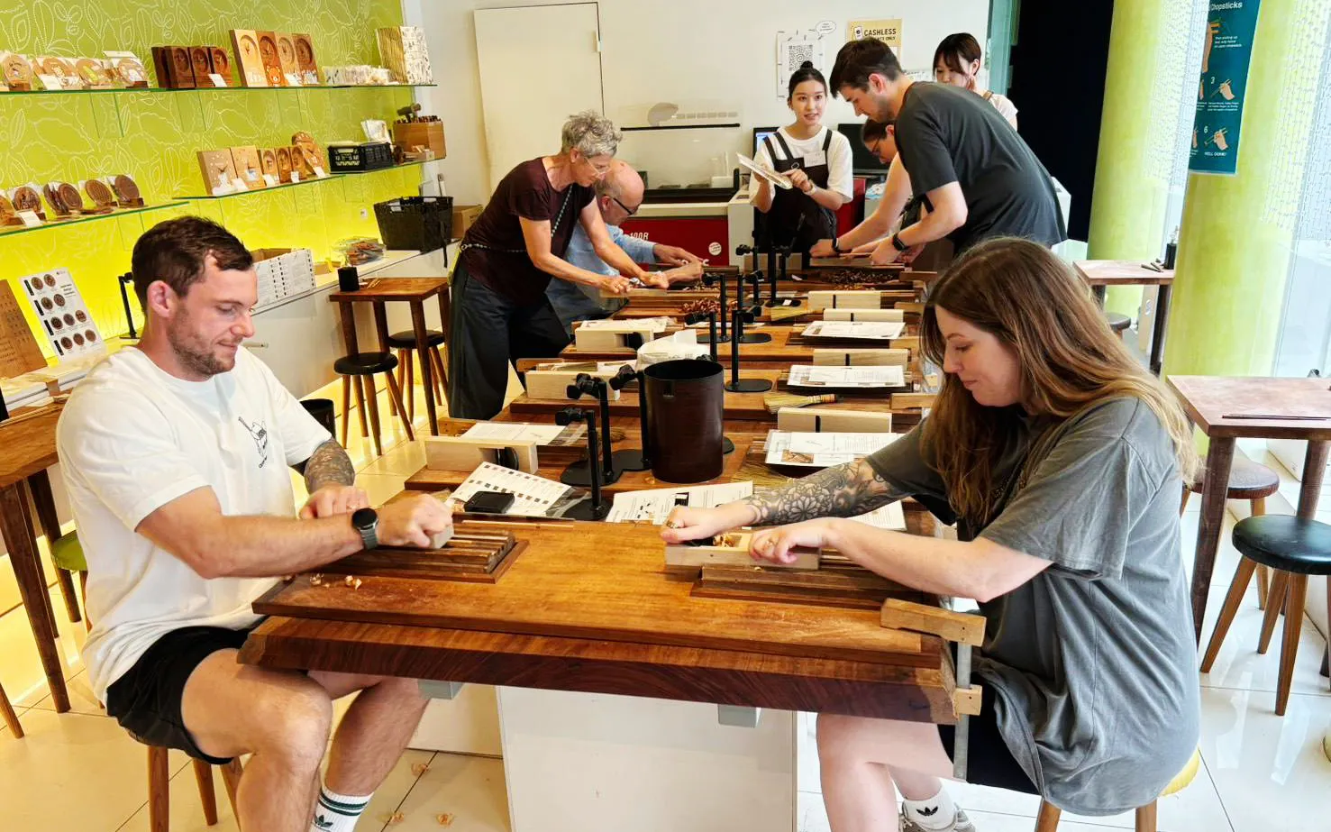 Participants crafting chopsticks at a workshop in Ginza.