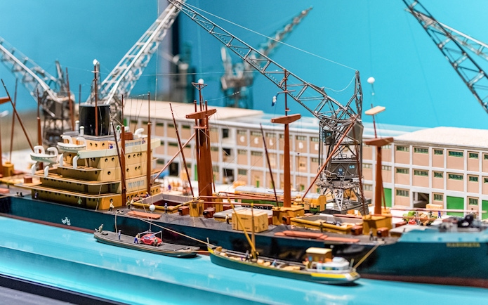Model ship and cranes exhibit inside The Maritime Museum, Amsterdam.