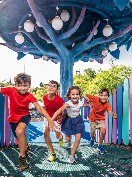 Children playing at Isla Mágica amusement park, Seville, Spain.