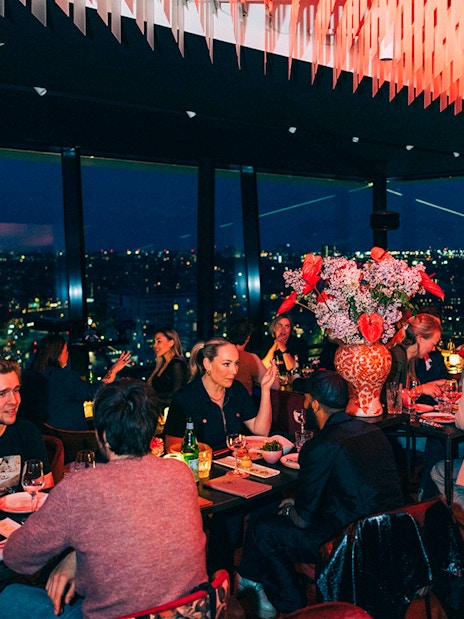 Dinner guests enjoying city views at Madam Skybar Restaurant.