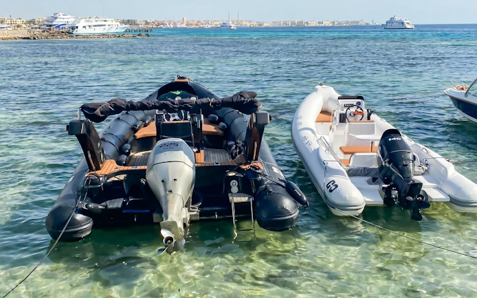Private speedboats docked at Orange Bay, Giftun Island, Hurghada, ready for snorkeling tour.
