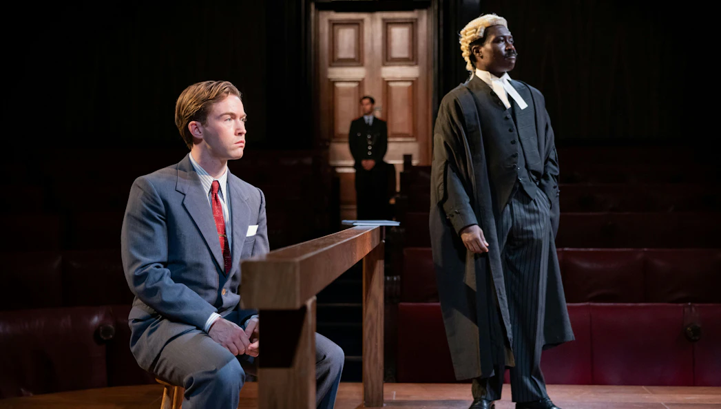 Courtroom scene from "Witness For The Prosecution" with a lawyer and defendant.