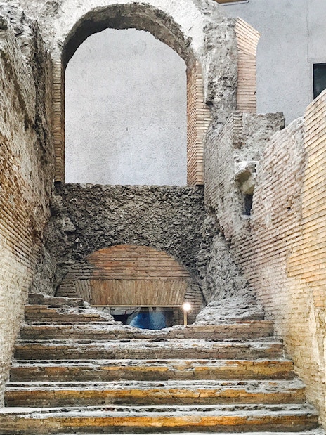 Ancient stone steps leading to an archway in Domitian Stadium, Rome.