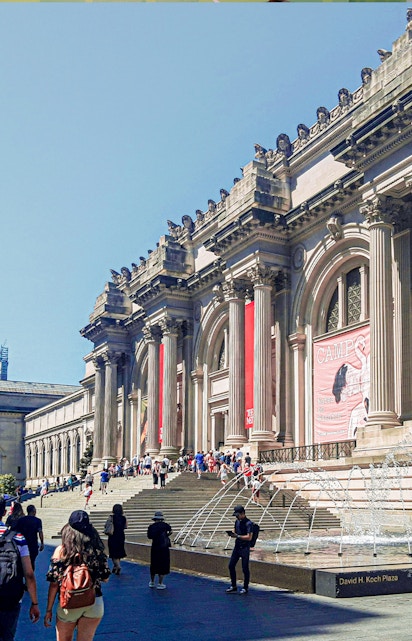 Visitors at the entrance of The Metropolitan Museum of Art, New York City.