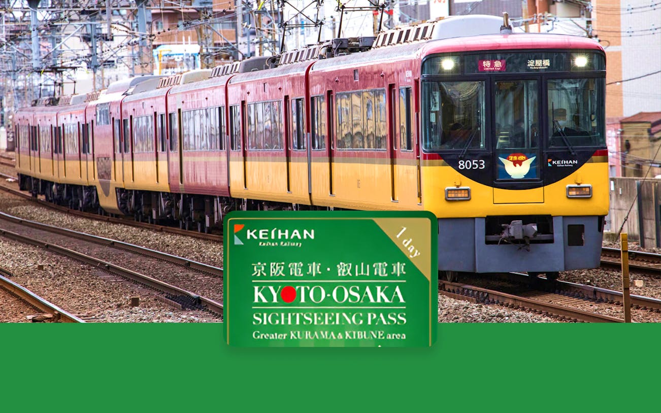 Keihan train on tracks with Kyoto-Osaka Sightseeing Pass sign for Greater Kurama & Kibune area.