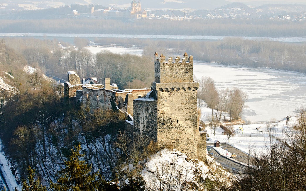 Ruins of Dürnstein Castle overlooking snowy Danube Valley, Austria, in winter.