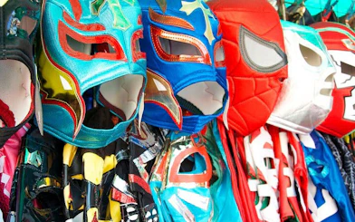 Colorful Lucha Libre masks displayed in a market in Mexico.
