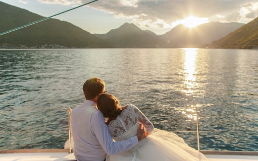 Couple enjoying sunset on a boat during Sorrento and Amalfi Coast cruise.