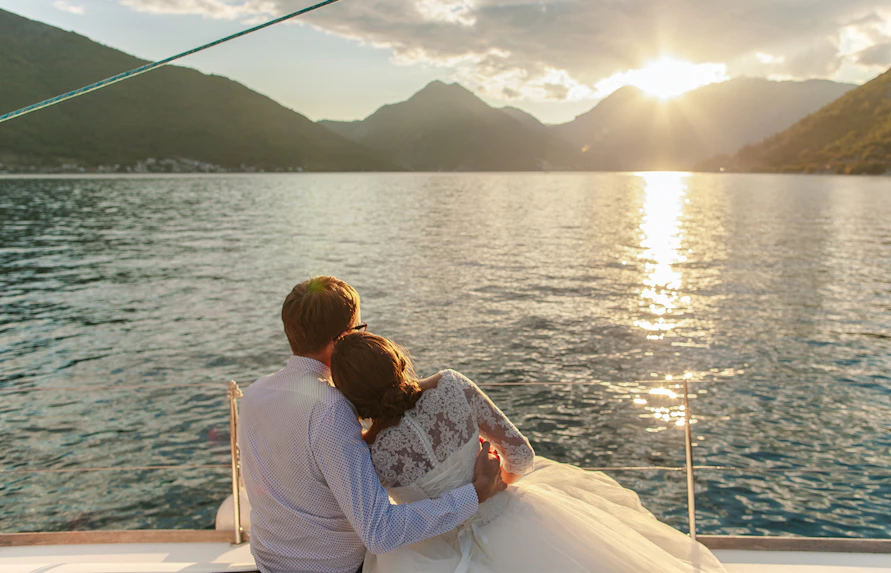 Couple enjoying sunset on a boat during Sorrento and Amalfi Coast cruise.