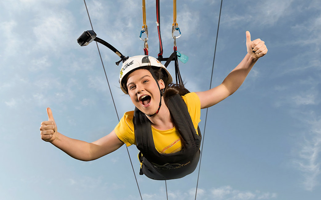Kid enjoying the Young Adventurer XLine zip line in Dubai Marina.