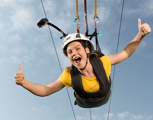 Child ziplining over Adventure Island in Safari world Bangkok