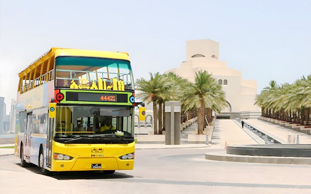 Open-top tour bus near Museum of Islamic Art in Doha.