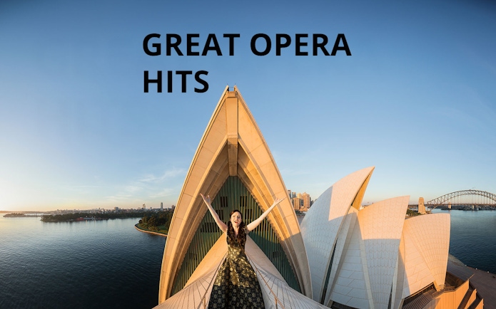 Opera singer on Sydney Opera House roof with city skyline, Great Opera Hits 2025.