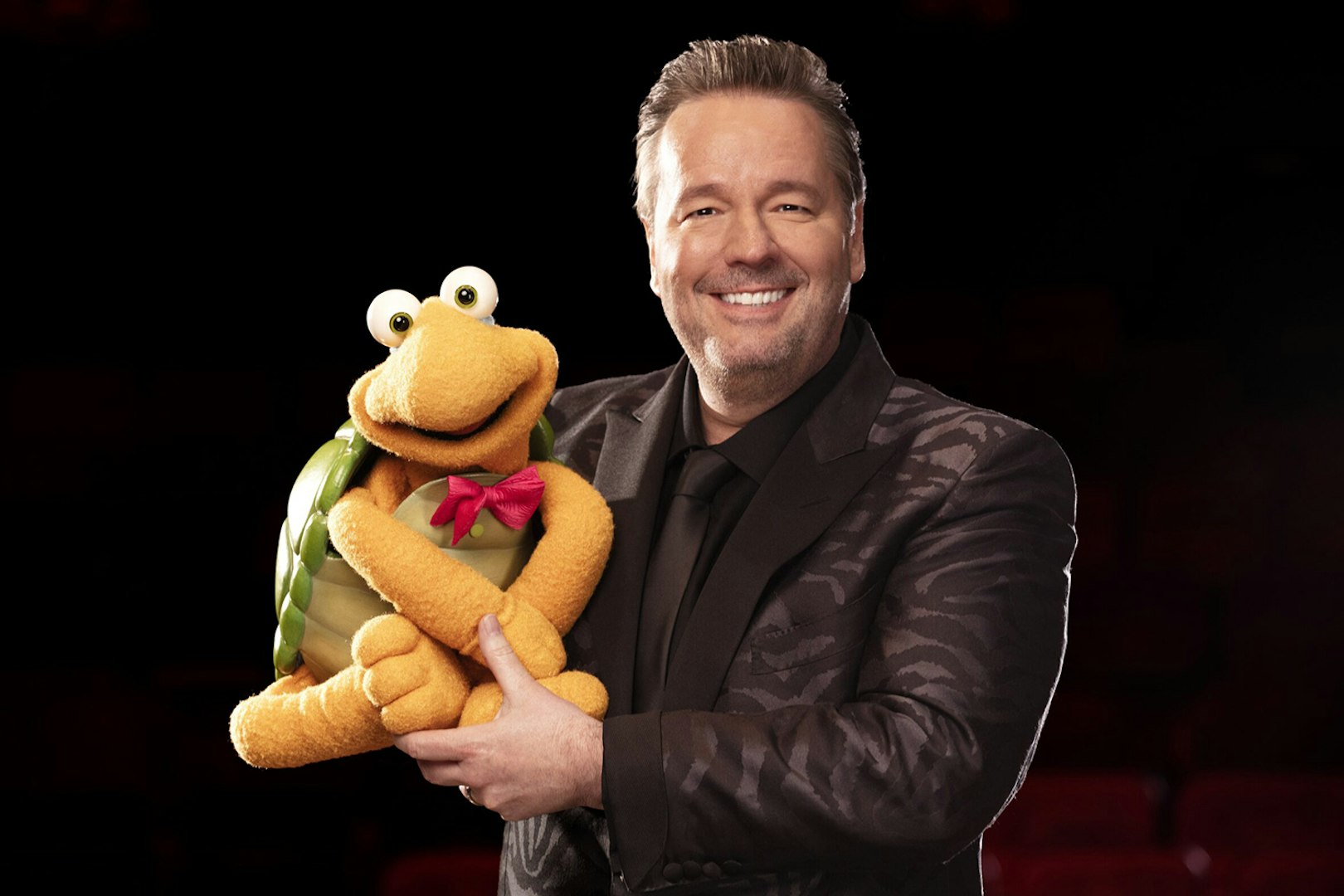 Ventriloquist with turtle puppet for "Terry Fator: One Man, a Hundred Voices, a Thousand Laughs!" show.