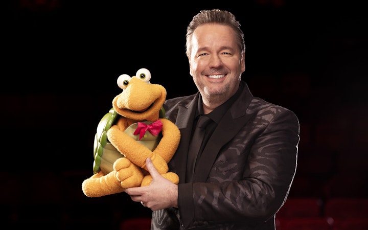 Ventriloquist with turtle puppet for "Terry Fator: One Man, a Hundred Voices, a Thousand Laughs!" show.