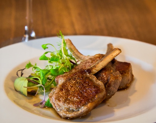Grilled lamb served on a platter in a Rome restaurant.