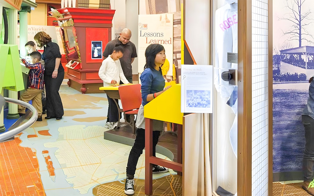Visitors exploring exhibits at New York Historical Society.