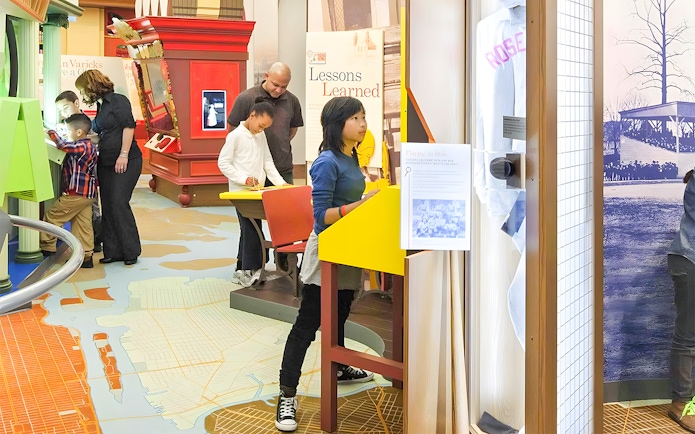 Visitors exploring exhibits at New York Historical Society.