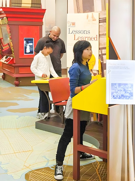 Visitors exploring exhibits at New York Historical Society.