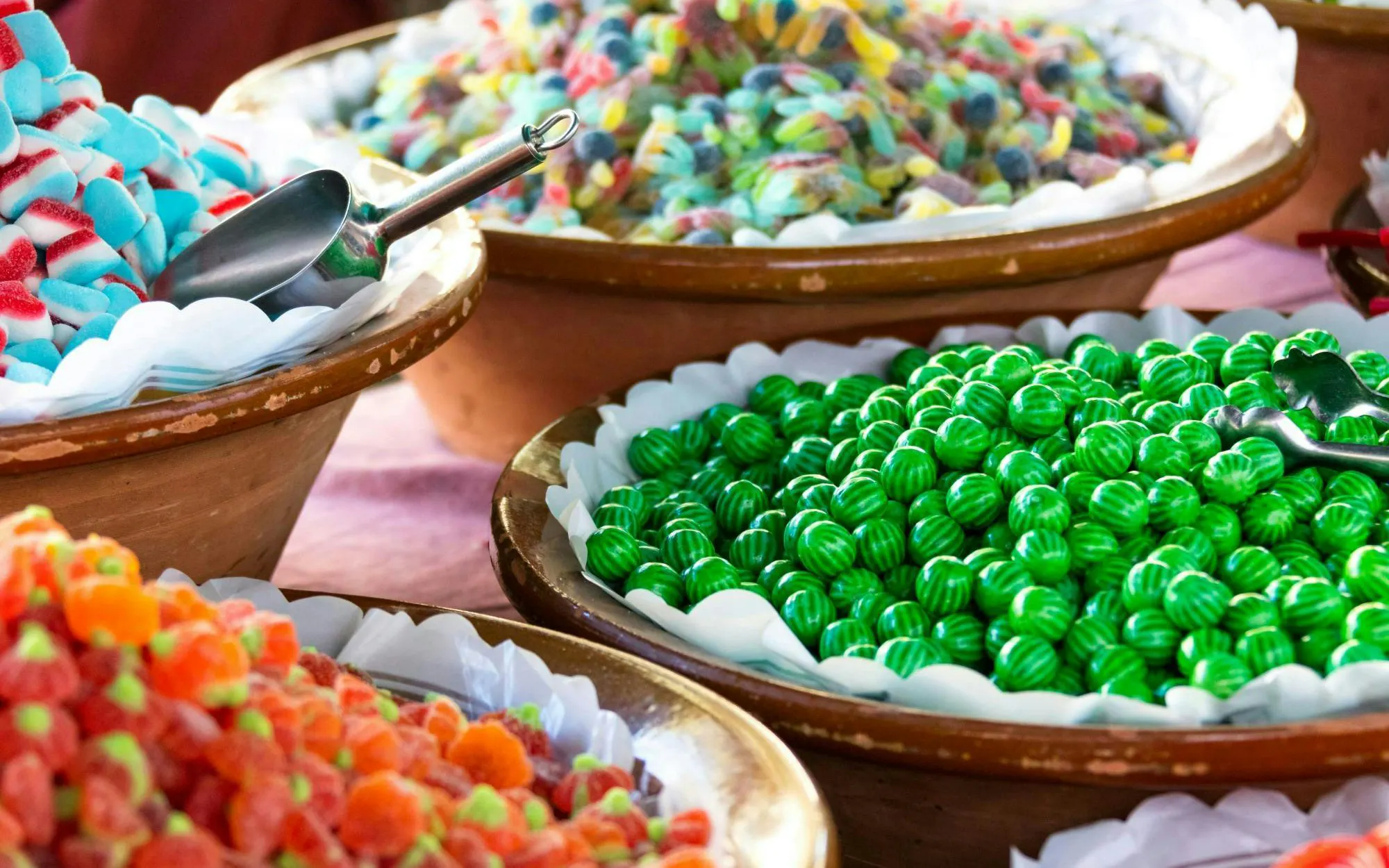 Bowls of colorful candies at Artà country market in Eastern Majorca, Spain.