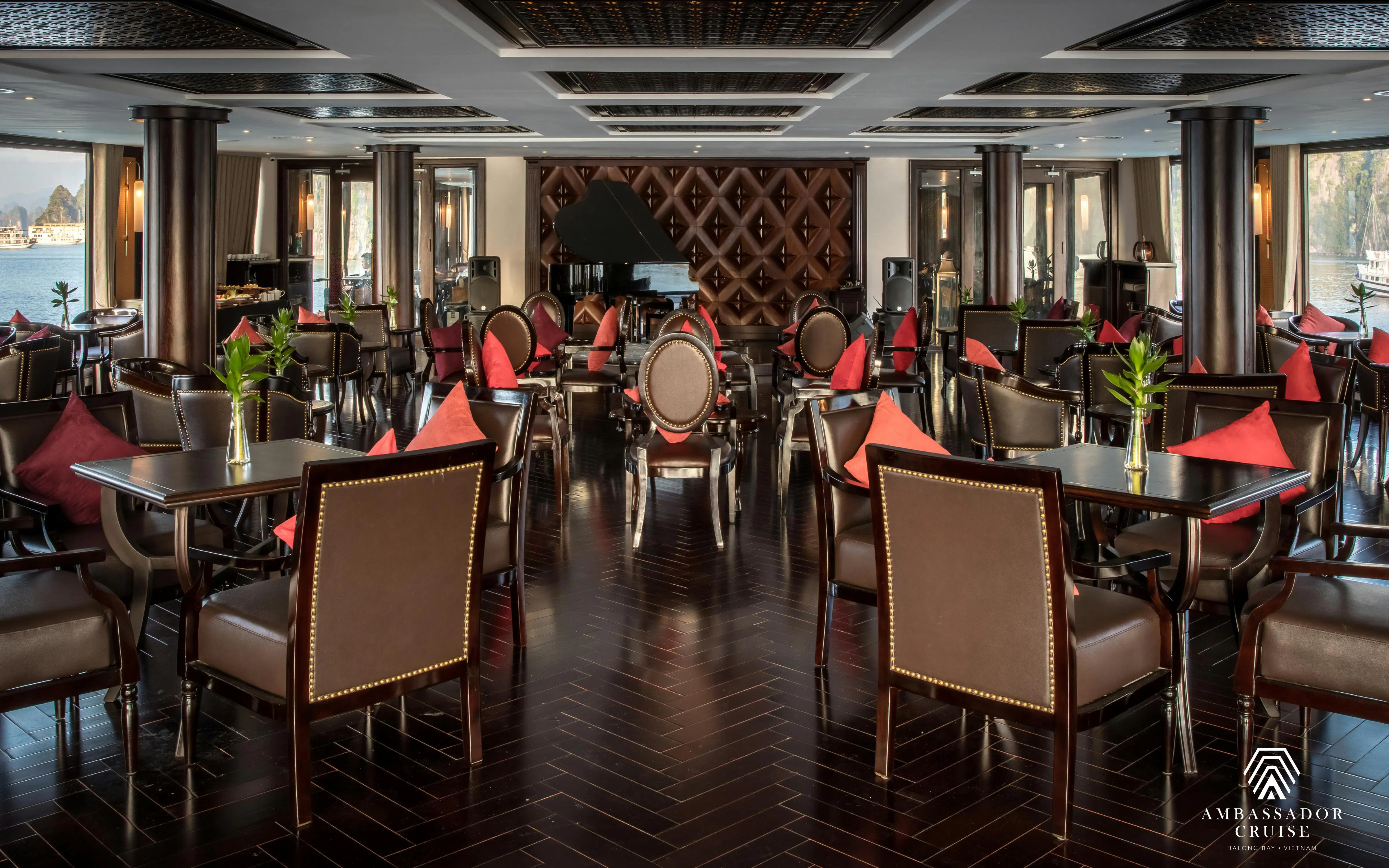 Luxurious dining area on Ha Long Bay 5-Star Ambassador Cruise with elegant seating and scenic views.