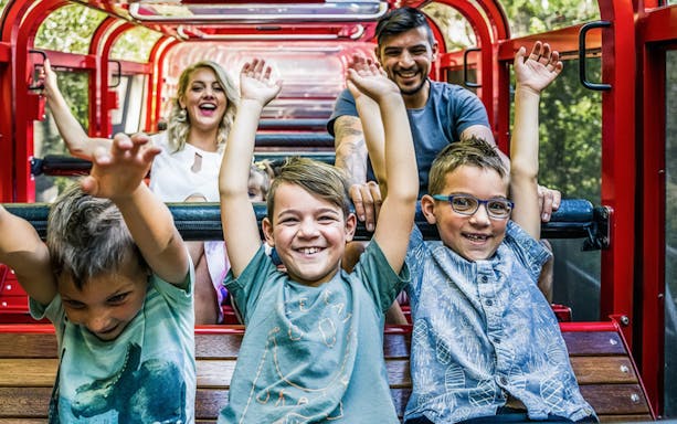 Family enjoying a ride on the forest railway at Scenic World, Blue Mountains.