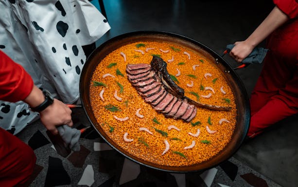 Paella with sliced meat and shrimp at STREETXOLAND Saturday Brunch, Dubai.