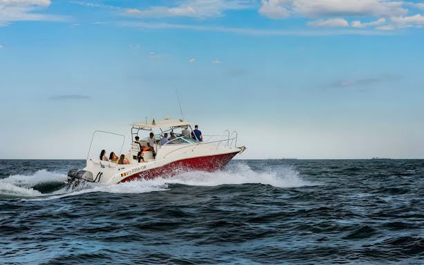 Speedboat cruising in the Black Sea with passengers enjoying the ride.